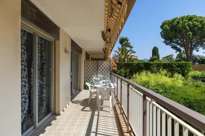 a balcony with a table and chairs on it at Happyfew La Suite Nicerama in Nice