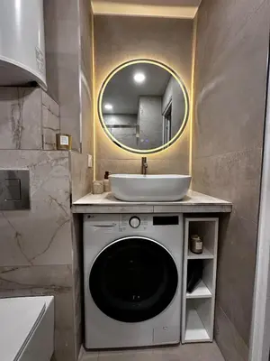 a bathroom with a washing machine and a sink at Sun, beach and relaxation in Cagnes-sur-Mer