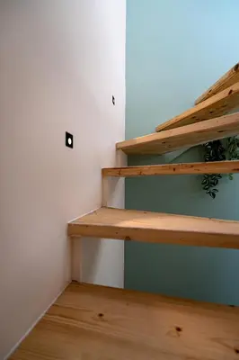 a stairwell in a room with wooden floors at La Vila-Vielha in Nice