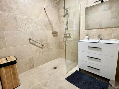 a bathroom with a shower and a sink at Quiet Flat with view and Swimming pool in Nice
