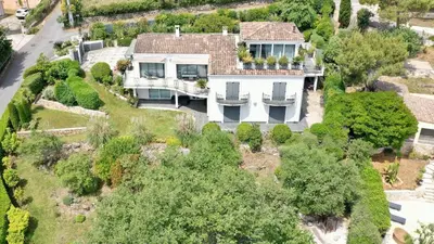 an aerial view of a large white house at Exceptional Villa with Sea View, Pool & Privacy in Gattières