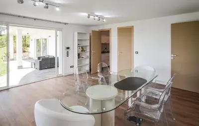 a dining room with a glass table and chairs at Exceptional Villa with Sea View, Pool & Privacy in Gattières