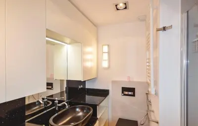 a bathroom with a sink and a mirror at Exceptional Villa with Sea View, Pool & Privacy in Gattières