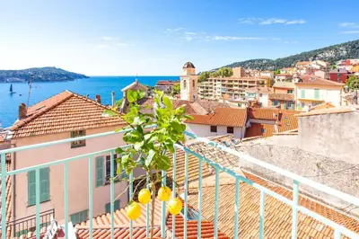 a view of the city of dubrovnik from a balcony at #50 Contesso Duplex -1BDR, Sea View Terrace & AC in Villefranche-sur-Mer