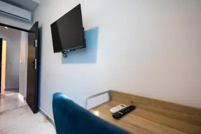 a bathroom with a sink and a mirror at Small Paradise 4 Cozy Rooms with AC in Nice