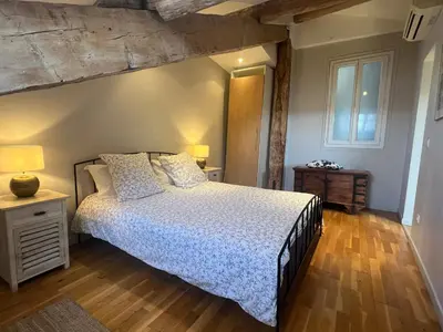 a bedroom with a bed and a wooden floor at 1 bedroom, Best location in Nice in Nice