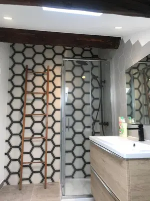 a bathroom with a wall with a glass door at 1 bedroom, Best location in Nice in Nice