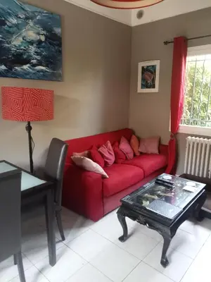 a bedroom with a bed and a view of a balcony at Family villa 10 minutes from Nice beaches in Nice