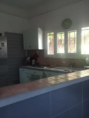 a living room with a sliding glass door and a television at Family villa 10 minutes from Nice beaches in Nice