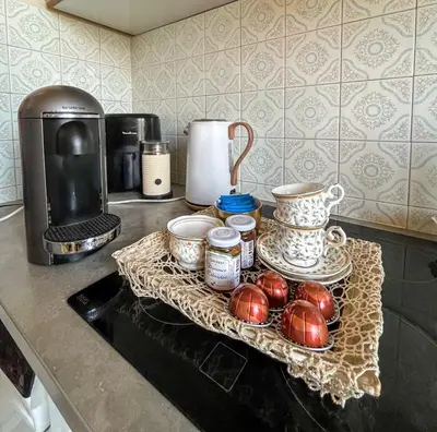 a kitchen counter with a tray of eggs and a coffee maker at 5 sky miniPenthouse in Nice