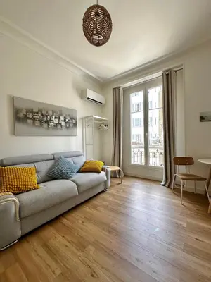 a living room with a couch and a table at Simply the best! All you need! in Nice