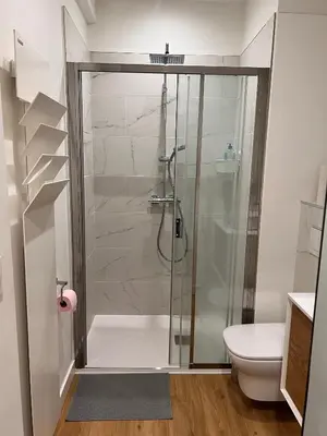 a bathroom with a shower and a toilet at Simply the best! All you need! in Nice