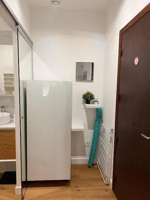 a white refrigerator in a room with a sink at Simply the best! All you need! in Nice