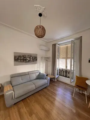 a living room with a couch and a table at Simply the best! All you need! in Nice