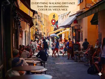 a bedroom with a bed with wooden floors and exposed beams at KALLISTE - NEW AC- Old town-Walk to everything - Beach- Restaurants-Supermarkets in Nice