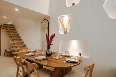 a kitchen and dining room with a table and chairs at KALLISTE - NEW AC- Old town-Walk to everything - Beach- Restaurants-Supermarkets in Nice