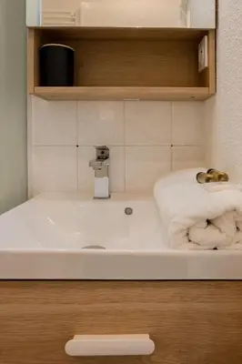 a bathroom with a sink with a towel on it at Nice, Studio Grande Terrasse à 2 pas de la promenade in Nice