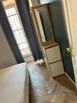 a bedroom with a bed and a window and a door at MOON 21 in Nice