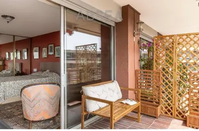 a bedroom with a bed and a chair in a room at Absea Nice Belles Terres 4 in Nice