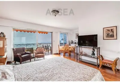 a bedroom with a bed and a television and a living room at Absea Nice Belles Terres 4 in Nice