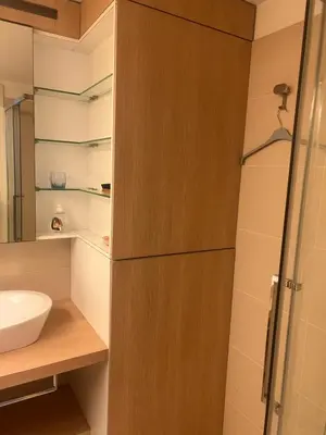 a bathroom with a sink and a toilet and a shower at Cosy studio piscine eze bord de mer in Èze