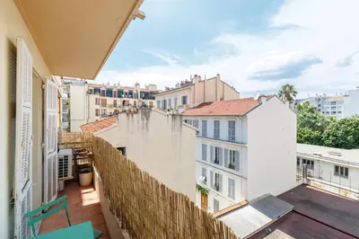 an apartment balcony with a view of buildings at Wide & Cozy 1 Bdr Downtown in Nice