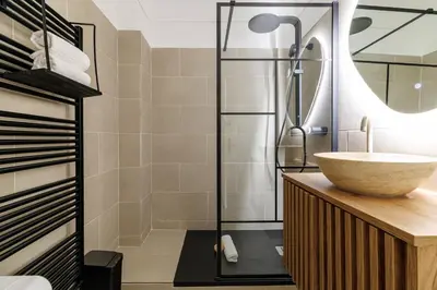 a bathroom with a sink and a shower at Wide & Cozy 1 Bdr Downtown in Nice