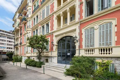 a large building with a door in a street at Studio cosy dans une belle copropriete classee in Nice