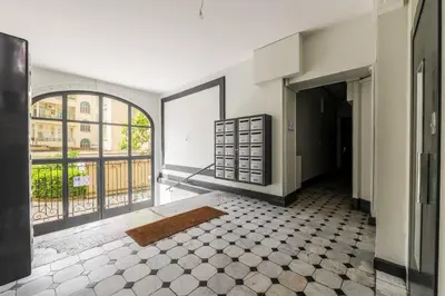 an empty room with a view of a building at Studio cosy dans une belle copropriete classee in Nice