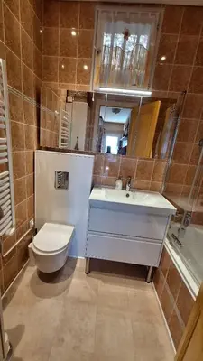 a bathroom with a sink and a toilet and a mirror at Villa in Nice French Riviera in Nice