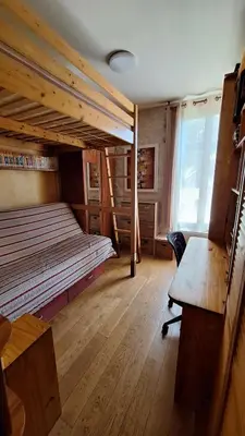 a bedroom with a bunk bed and a desk and a chair at Villa in Nice French Riviera in Nice