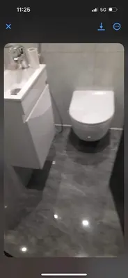 a bathroom with a white toilet and a sink at Endroit calme in Nice