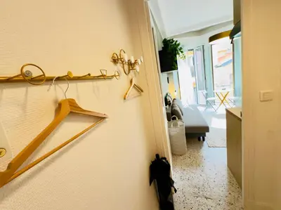 a room with a door with hangers on the wall at Petit Bijou 1 Pers Centrale WiFI in Nice