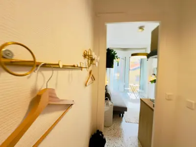 a room with a hallway with a mirror on the wall at Petit Bijou 1 Pers Centrale WiFI in Nice