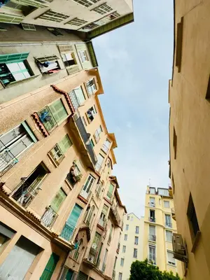a view of a tall building from between two buildings at Petit Bijou 1 Pers Centrale WiFI in Nice