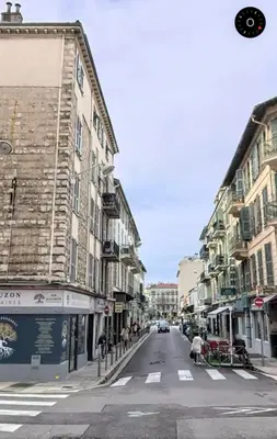 an empty street in a city with buildings at Nest In Nice in Nice
