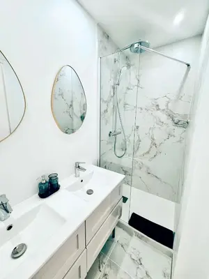 a bathroom with a sink and a shower at Nest In Nice in Nice