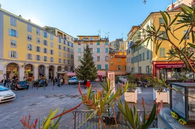 a city street with buildings and a christmas tree at Cute duplex studio in Nice