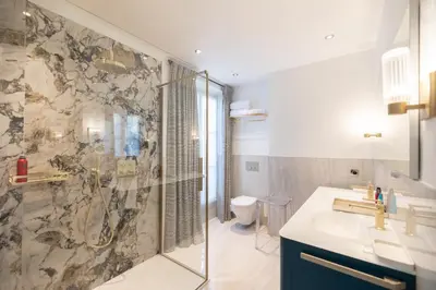 a bathroom with a shower and a sink at Villa Soleil Riviera in Villefranche-sur-Mer