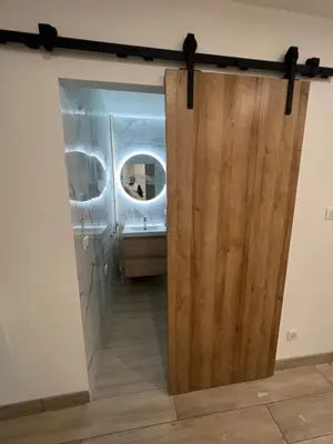 a door leading into a bathroom with a mirror at Appartement-Centre ville -Climatisé-Terrasse-Parking in Cagnes-sur-Mer