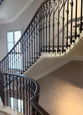 a staircase with black railings in a home at Studio Carabacel in Nice