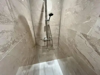 a shower with a glass door in a bathroom at Nice Signature Halevy Terrasse in Nice
