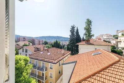 a dining room with a glass table and chairs at Wide 1 Bdr Quiet Area Open View in Nice