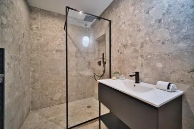 a bathroom with a sink and a shower at MAYERBEER - Apartment 2 bedrooms with balcony in Nice