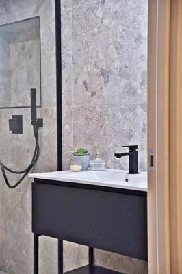 a bathroom with a sink and a shower at MAYERBEER - Apartment 2 bedrooms with balcony in Nice