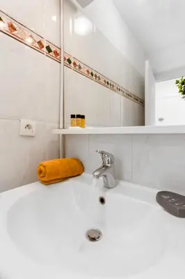 a bathroom with a sink and a mirror at Le Seaside - Beach - Tram - Airport - AC in Nice