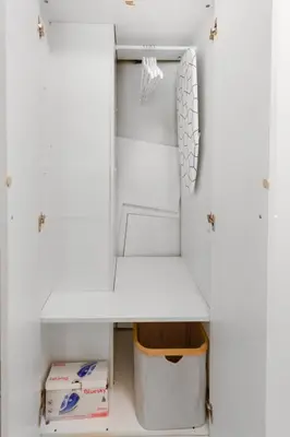 an open refrigerator with a shelf and a box at Le Seaside - Beach - Tram - Airport - AC in Nice