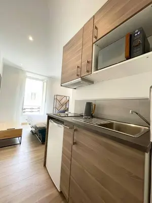 a kitchen with a sink and a counter top at Studio en plein centre de Nice, proche Tramway in Nice