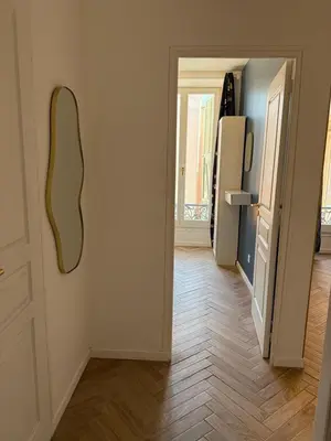 a room with a white door and a refrigerator at MOON - 31 in Nice