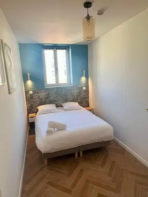 a bedroom with a large bed in a room at MOON - 37 in Nice